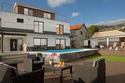 a villa with a swimming pool and a house at Luxury Calheta Villa Casa Da Rosalina 5 Bedrooms Stunning Sea Views in Calheta