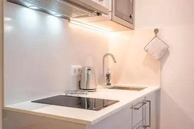 a kitchen with a sink and a counter top at Funchal Center Apartment II in Funchal