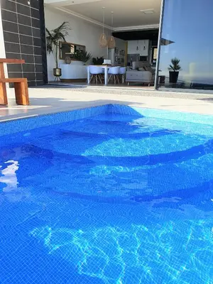 a large blue swimming pool in a house at Villa Brava Atlântico in Ribeira Brava