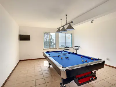 a large room with a pool table in it at Villa Prainha by LovelyStay in Caniçal