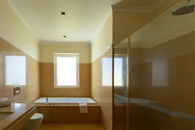 a bathroom with a tub and a toilet and a shower at Bellevue Villa Madeira Magnificent Sea View in Prazeres