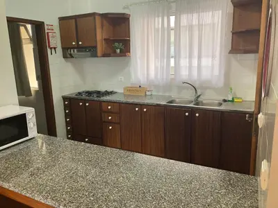 a kitchen with a sink and a counter top at Costa Azul in Porto Moniz