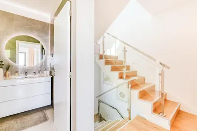 a bathroom with a staircase and a mirror at Villa Belmonte by LovelyStay in Ponta do Sol