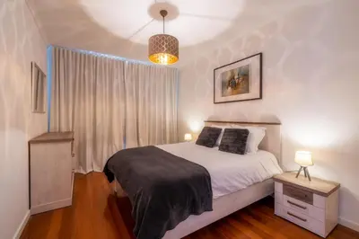 a bedroom with a bed and a window at Sea View by Atlantic Holiday in Caniço
