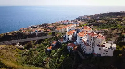 an aerial view of a town on a hill next to the ocean at Sea View by Atlantic Holiday in Caniço