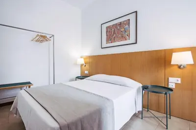 a hotel room with a bed and a mirror at Murças74 - Studio Apartments in Funchal