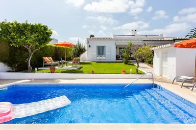 a swimming pool in front of a house at CoolHouses Algarve Lagos, V3 Casa Evasion in Lagos