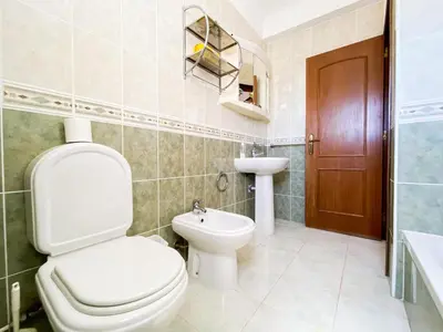 a bathroom with a toilet and a sink at Retreat with Terrace and View in Espiche #1887 in Espiche