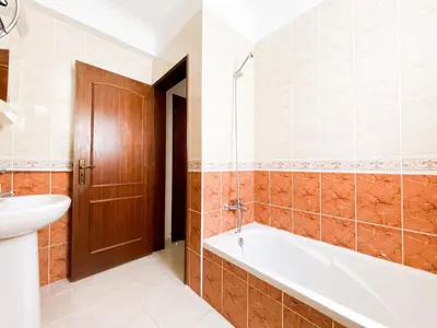 a bathroom with a tub and a toilet and a sink at Simple Beach Lovers' Retreat in Espiche #1888 in Espiche