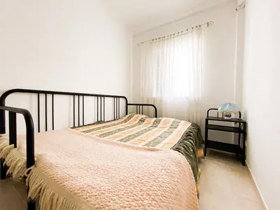 a bedroom with a bed and a window at Simple Beach Lovers' Retreat in Espiche #1888 in Espiche
