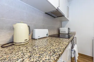 a kitchen with a counter top with a appliance on it at Ilha Natura in Santana