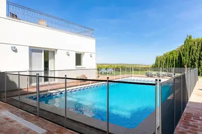 a swimming pool on a balcony of a house at Villa Ocean Blue in Sagres