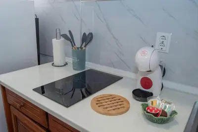 a kitchen counter with a cookie on the counter top at Sunset Star with Sea View in Calheta