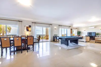 a living room with a pool table in it at CoolHouses Algarve Luz, 5 bed villa & pool, Casa N in Luz