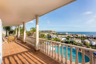 a balcony with a view of the ocean at CoolHouses Algarve Luz, 5 bed villa & pool, Casa N in Luz