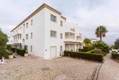 a large white house with a courtyard at CoolHouses Algarve Luz, 1 bed penthouse flat w/ sea views. Fiji 11 in Luz