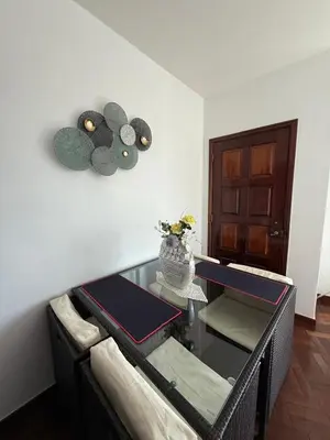 a room with a glass table with a vase on the wall at Casa 212 in Ponta do Sol