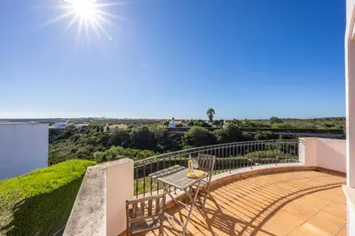a view from the balcony of a house with a table at Casa Gribouille in Sagres