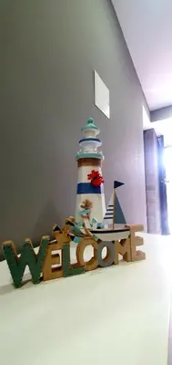 a cake with a lighthouse on top of a table at Casa da Rocha in Paul do Mar