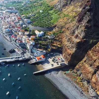 an aerial view of a town on the side of a mountain at Casa da Rocha in Paul do Mar