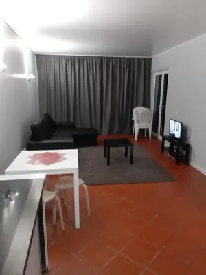 a living room with a couch and a table at Apartamentos Matur Flats 2 in Machico