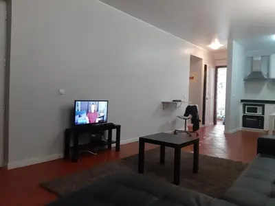 a living room with a couch and a tv at Apartamentos Matur Flats 2 in Machico