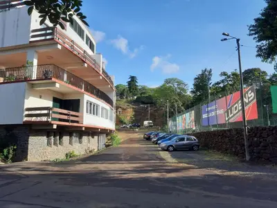 a row of cars parked next to a building at Apartamentos Matur Flats 2 in Machico
