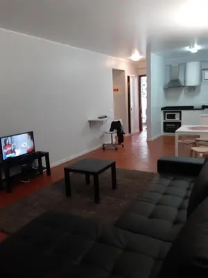 a living room with a couch and a table at Apartamentos Matur Flats 2 in Machico