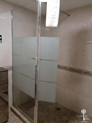 a shower with a glass door in a bathroom at Casa da Edite in Ponta do Sol