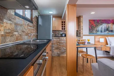 a kitchen with a sink and a counter at Casa do Miradouro -Fantástico Estúdio in Santa Cruz