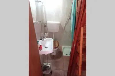 a bathroom with a toilet and a sink at Casinha de Aldeia no coração da Costa Vicentina in Vila do Bispo