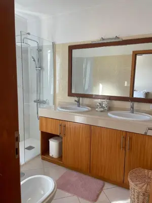a bathroom with a sink and a shower at Apartamento Jade in Caniço