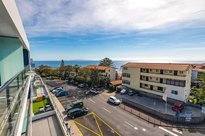 a view of a parking lot from a building at Sun and Sea II in Caniço
