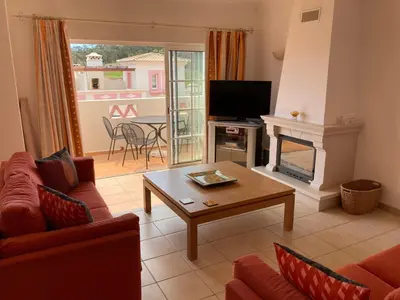 a living room with a couch and a table at Luxury private property-pool, unique sun roof, free wifi in Budens
