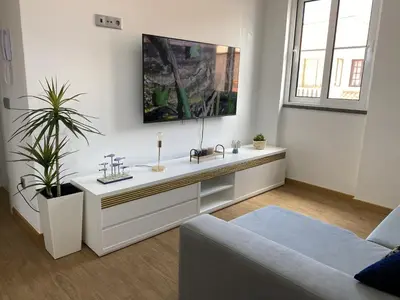 a living room with a sink and a couch at Casas do Baleeiro - Whaler's Houses by Rentery Madeira in Caniçal