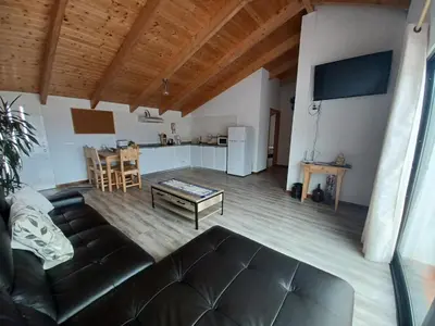 a living room with a couch and a table at Villa Luz II - NEW - Private Outdoor Area in Santa Cruz