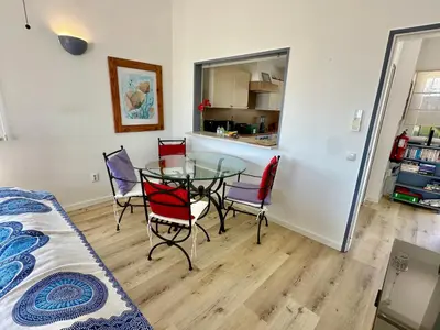 a bedroom with a bed and a sliding glass door at Vila Vista Luz in Lagos