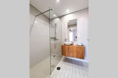 a bathroom with a glass shower and a sink at Santa Luzia's Pearl VI - Two Bed Apartment in Funchal