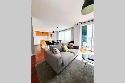 a living room with a couch and a table at Santa Luzia's Pearl VI - Two Bed Apartment in Funchal
