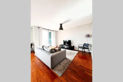 a living room with a couch and a table at Santa Luzia's Pearl VI - Two Bed Apartment in Funchal