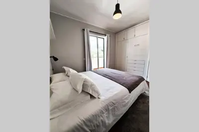 a bedroom with a bed and a window at Santa Luzia's Pearl VI - Two Bed Apartment in Funchal