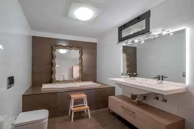 a bathroom with a sink and a mirror at OurMadeira - Garden Paradise in Calheta