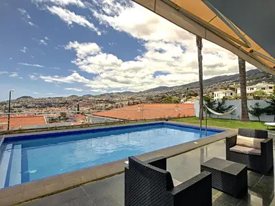 a swimming pool with a view of a city at The White House - By LovelyStay in Funchal