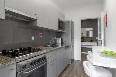 a kitchen with a sink and a stove top oven at FLH Funchal Nature Flat with Balcony in Funchal