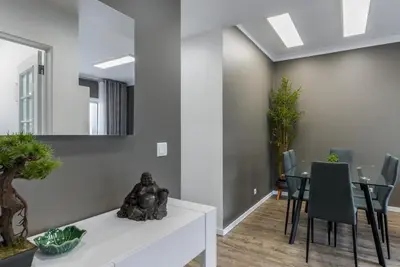 a living room with a statue sitting on a table at FLH Funchal Nature Flat with Balcony in Funchal