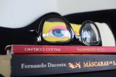 a pair of glasses sitting on top of a book at Angel's Apartment in Funchal