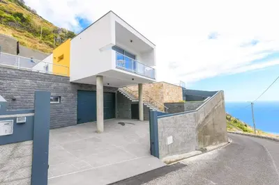 a house with a view of the ocean at Villa Golden Charm in Tábua