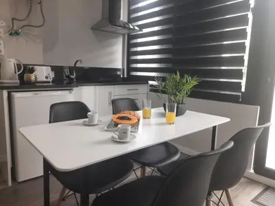 a white table and chairs in a kitchen at Marques studio in Porto da Cruz