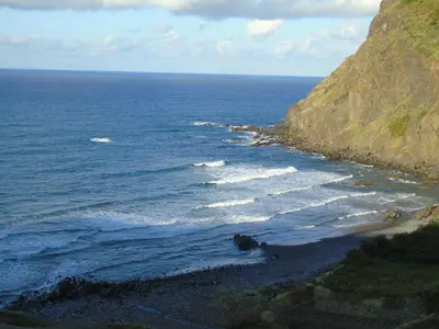an aerial view of the ocean and a rocky beach at Marques studio in Porto da Cruz
