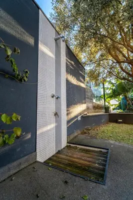 a wall with a door with a grate on it at Beach Sunset Villa 100m from Ocean & Beach in Paul do Mar